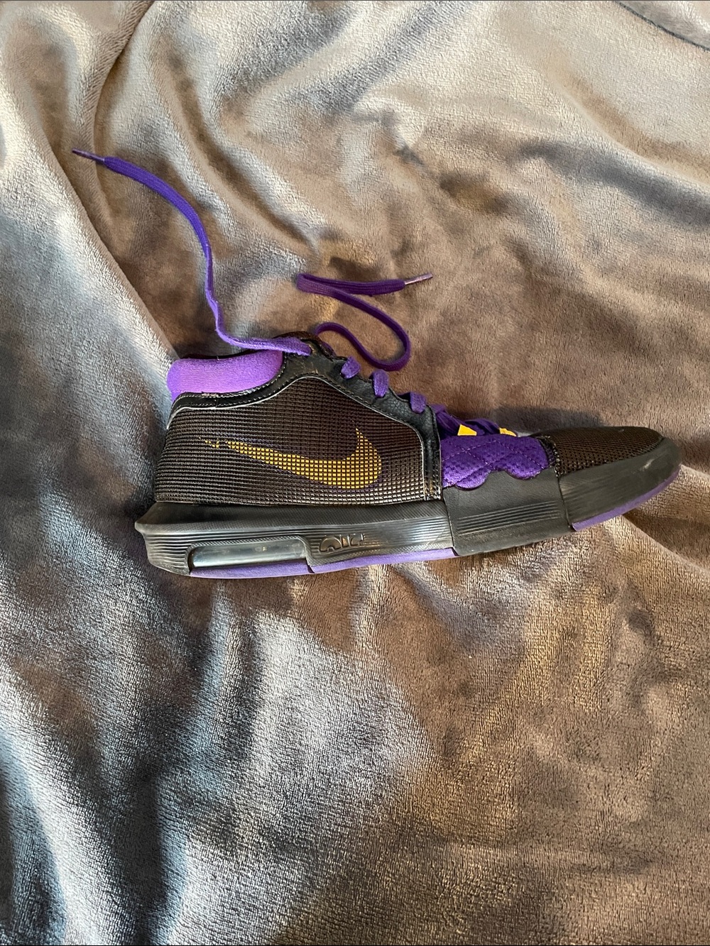 Nike LeBron Black and Purple Athletic Shoe with Gold Swoosh